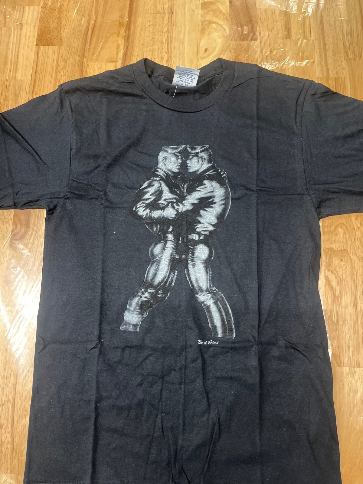 A T-shirt of the Famous art by Tom of Finland of a “Leather “ Duo in a very intimate proximity 